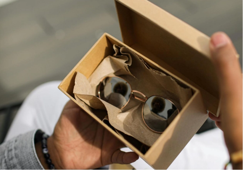 A pair of stylish round rose-gold sunglasses with mirrored lenses